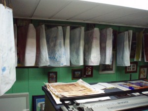 Collage papers hanging up to dry.