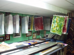 Collage papers hanging up to dry.